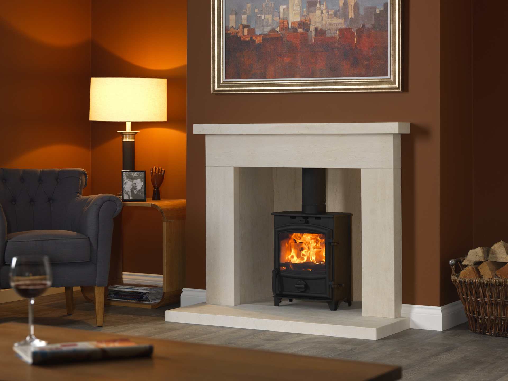 Modern living room with a lit wood-burning stove inside a cream fireplace.